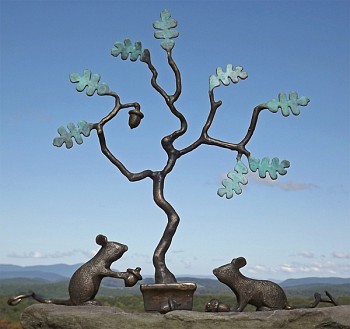 This bronze by Michael McLaughlin depicts two mice, one holding an acorn at the base of an oaks tree.